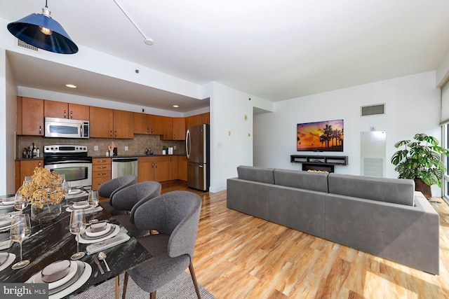901 N Penn St Unit R305, Philadelphia, PA 19123 - living room featuring light wood finished floors