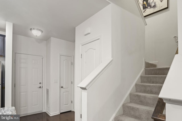 16894 Porters Inn Dr, Dumfries, VA 22026 - entryway featuring stairway, dark wood finished floors, and baseboards