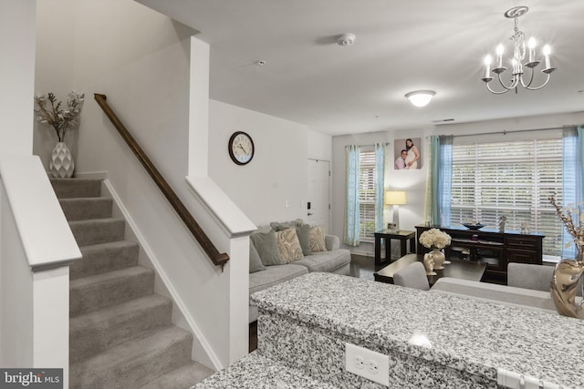16894 Porters Inn Dr, Dumfries, VA 22026 - living area featuring a chandelier, stairway, and baseboards