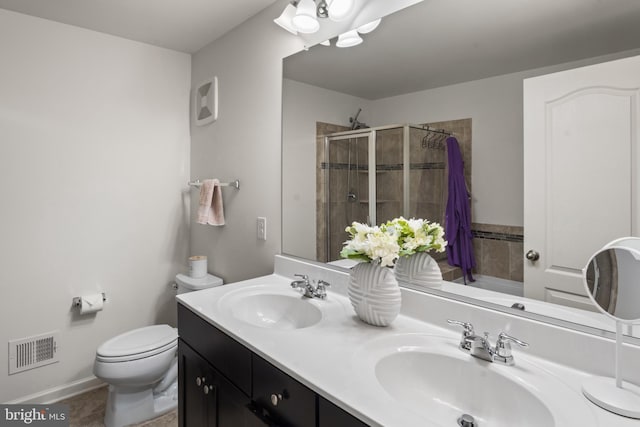 16894 Porters Inn Dr, Dumfries, VA 22026 - bathroom featuring toilet, a stall shower, and double vanity