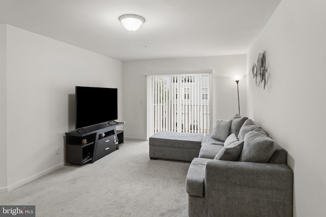 16894 Porters Inn Dr, Dumfries, VA 22026 - living room featuring carpet floors and baseboards
