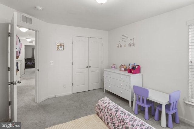 16894 Porters Inn Dr, Dumfries, VA 22026 - carpeted bedroom featuring a closet and baseboards