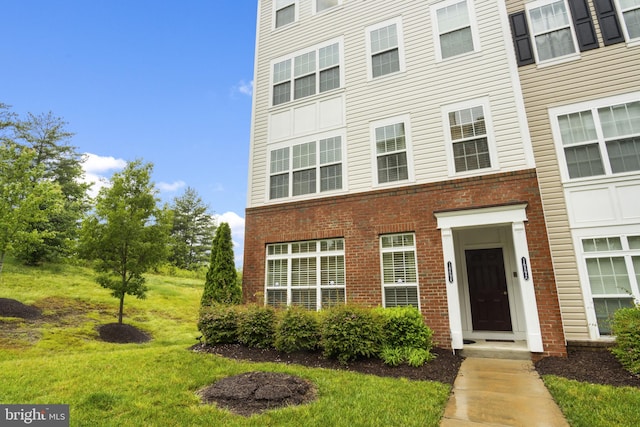 16894 Porters Inn Dr, Dumfries, VA 22026 - townhome / multi-family property featuring brick siding