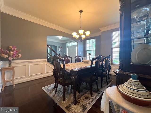 3348 Soaring Cir, Woodbridge, VA 22193 - dining room featuring crown molding, arched walkways, a chandelier, wainscoting, and dark wood-style floors