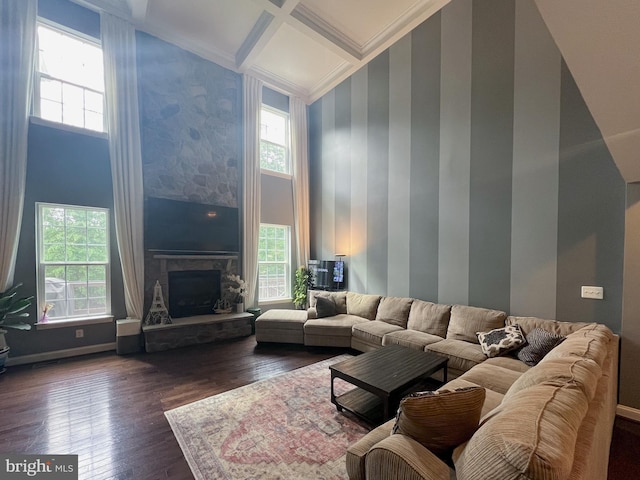 3348 Soaring Cir, Woodbridge, VA 22193 - living room with healthy amount of natural light, dark wood-type flooring, a stone fireplace, ornamental molding, and a towering ceiling