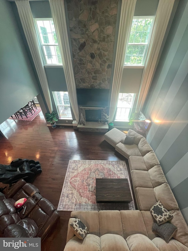 3348 Soaring Cir, Woodbridge, VA 22193 - living area with a fireplace, healthy amount of natural light, and wood finished floors