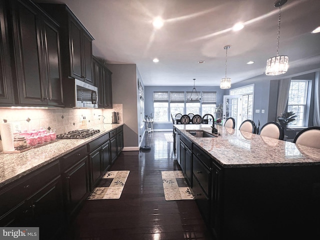 3348 Soaring Cir, Woodbridge, VA 22193 - kitchen with appliances with stainless steel finishes, a sink, recessed lighting, a spacious island, and decorative backsplash