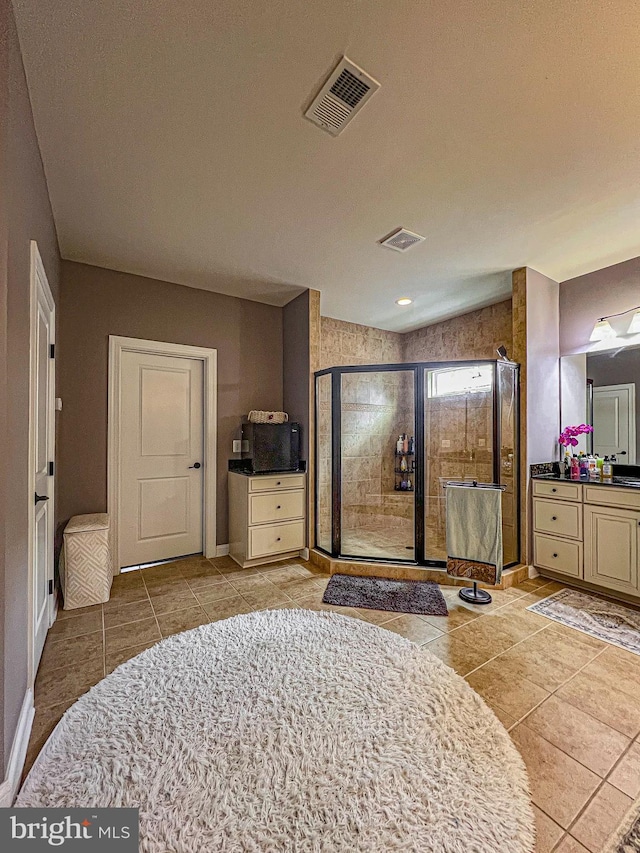 3348 Soaring Cir, Woodbridge, VA 22193 - bathroom featuring vanity, a stall shower, tile patterned flooring, and baseboards