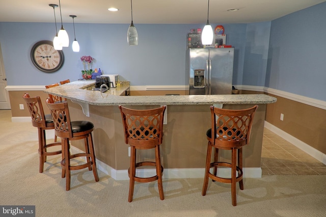 3348 Soaring Cir, Woodbridge, VA 22193 - indoor wet bar featuring stainless steel fridge with ice dispenser, light colored carpet, pendant lighting, recessed lighting, and baseboards