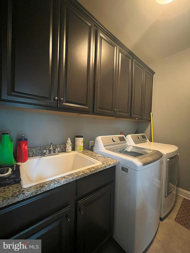 3348 Soaring Cir, Woodbridge, VA 22193 - laundry area with independent washer and dryer, cabinet space, light tile patterned floors, and baseboards