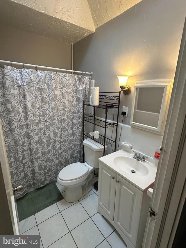7420 Torresdale Ave, Philadelphia, PA 19136 - full bathroom featuring toilet, vanity, tile patterned floors, and a shower with shower curtain