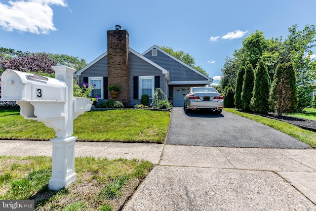 3 Canterbury Pl, Southampton, NJ 08088 - single story home with a garage, driveway, a front lawn, and a chimney