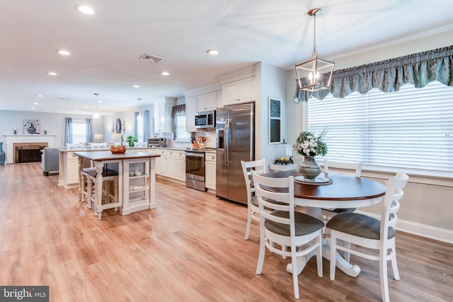 3 Canterbury Pl, Southampton, NJ 08088 - dining room with recessed lighting, light wood finished floors, a fireplace, and baseboards