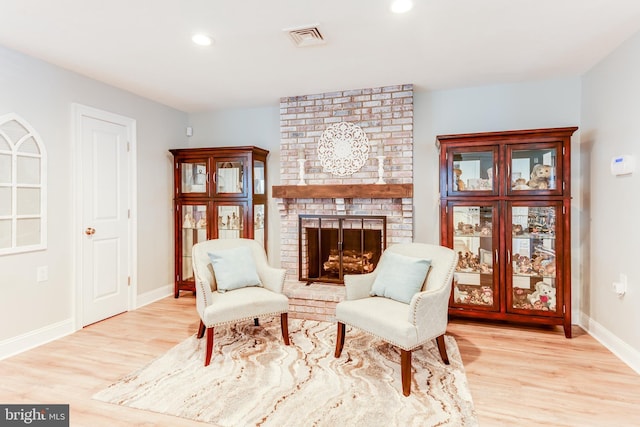 3 Canterbury Pl, Southampton, NJ 08088 - sitting room with light wood finished floors, a brick fireplace, baseboards, and recessed lighting