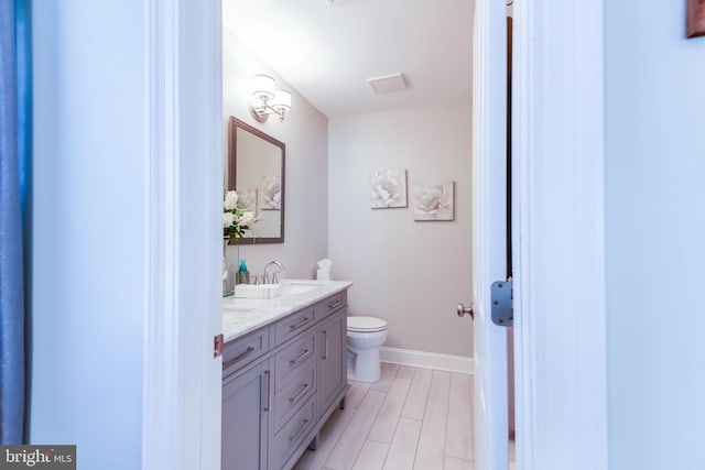 3 Canterbury Pl, Southampton, NJ 08088 - bathroom with double vanity, toilet, and baseboards