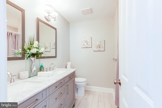 3 Canterbury Pl, Southampton, NJ 08088 - bathroom with double vanity, baseboards, and toilet