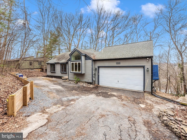 6518 Rimrock Rd, New Market, MD 21774 - view of front of home featuring driveway, a shingled roof, and a garage