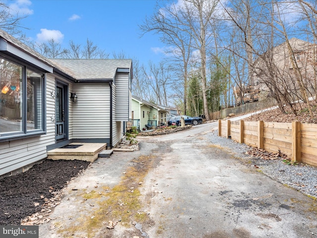 6518 Rimrock Rd, New Market, MD 21774 - view of home's exterior featuring a shingled roof and driveway
