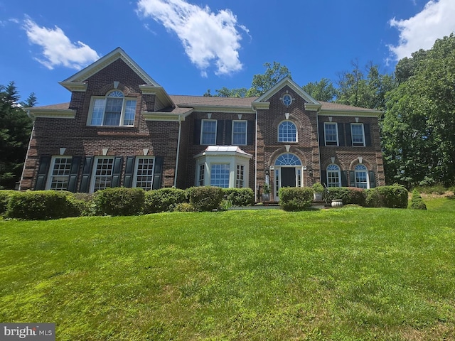 25024 Johnson Farm Rd, Laytonsville, MD 20882 - colonial-style house with a front lawn and brick siding