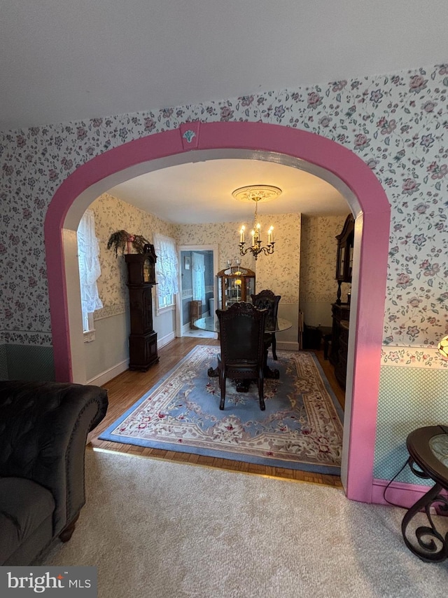 10 E Taunton Ave, Berlin, NJ 08009 - dining room featuring wallpapered walls, arched walkways, and a chandelier