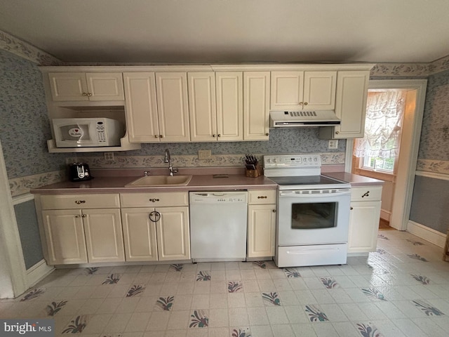 10 E Taunton Ave, Berlin, NJ 08009 - kitchen featuring white appliances, under cabinet range hood, a sink, wallpapered walls, and baseboards