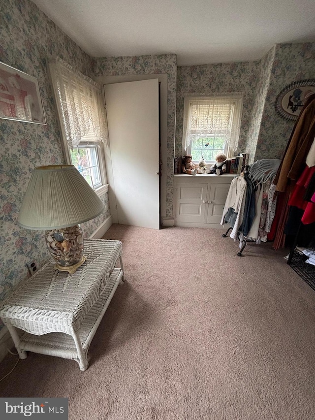 10 E Taunton Ave, Berlin, NJ 08009 - living area with wallpapered walls, healthy amount of natural light, and carpet floors