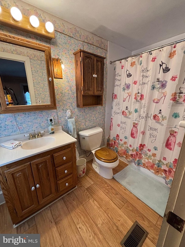 10 E Taunton Ave, Berlin, NJ 08009 - full bathroom featuring vanity, toilet, wood finished floors, wallpapered walls, and a shower with curtain