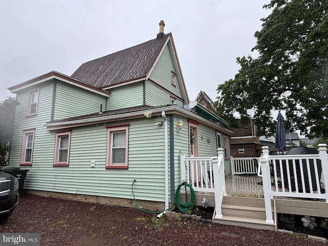 10 E Taunton Ave, Berlin, NJ 08009 - view of property exterior with a deck and a shingled roof