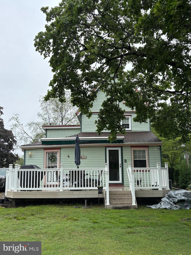 10 E Taunton Ave, Berlin, NJ 08009 - view of front of home featuring a wooden deck and a front yard