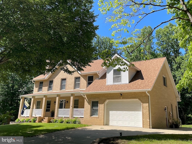 1602 Locksley Dr, Annapolis, MD 21401 - view of front of home with a porch, a garage, driveway, brick siding, and a shingled roof