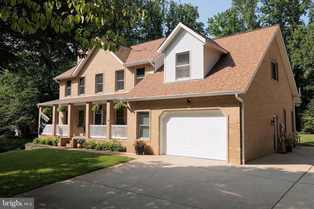 1602 Locksley Dr, Annapolis, MD 21401 - view of front of home with covered porch, driveway, a shingled roof, and brick siding