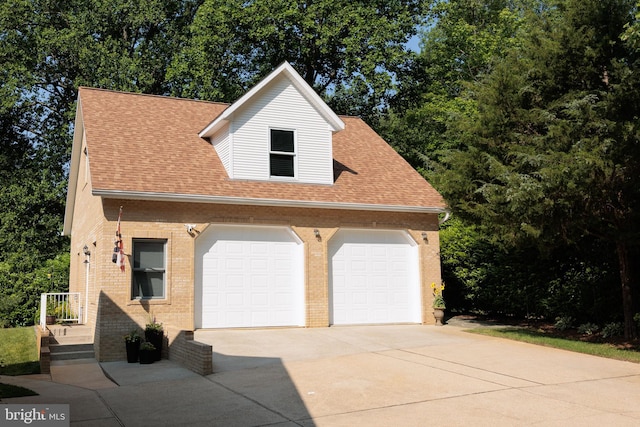1602 Locksley Dr, Annapolis, MD 21401 - view of front facade featuring brick siding, driveway, a shingled roof, and an attached garage