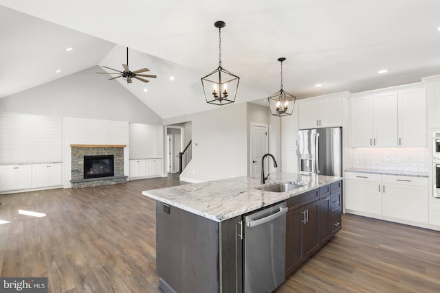 125 Lake Holiday Rd, Cross Junction, VA 22625 - kitchen with stainless steel appliances, a sink, white cabinets, high vaulted ceiling, and dark wood-style flooring