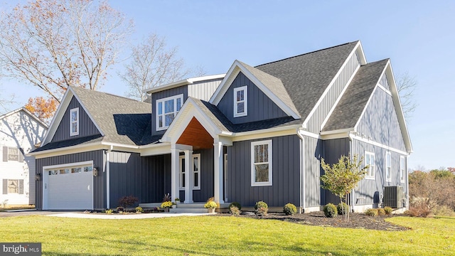 125 Lake Holiday Rd, Cross Junction, VA 22625 - view of front of house with roof with shingles, a front lawn, an attached garage, and board and batten siding