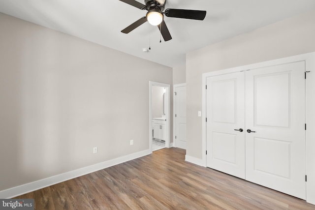 125 Lake Holiday Rd, Cross Junction, VA 22625 - unfurnished bedroom featuring wood finished floors, baseboards, a closet, and ensuite bathroom