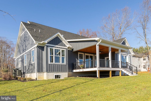 125 Lake Holiday Rd, Cross Junction, VA 22625 - rear view of house featuring board and batten siding, a ceiling fan, a yard, and a shingled roof