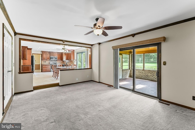 2 Raven Dr, Chadds Ford, PA 19317 - unfurnished living room featuring ornamental molding, a ceiling fan, baseboards, and light carpet