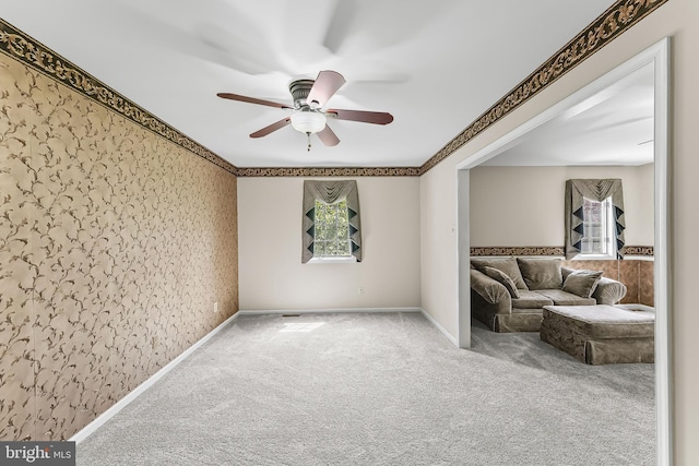 2 Raven Dr, Chadds Ford, PA 19317 - unfurnished living room featuring ceiling fan, carpet, healthy amount of natural light, and wallpapered walls