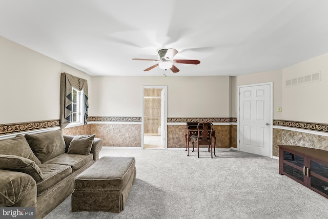 2 Raven Dr, Chadds Ford, PA 19317 - living area with a wainscoted wall, ceiling fan, and carpet