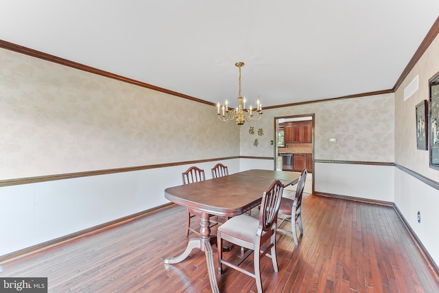 2 Raven Dr, Chadds Ford, PA 19317 - dining room featuring wallpapered walls, a chandelier, wood-type flooring, ornamental molding, and baseboards