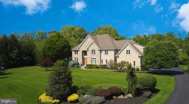 10 Eastburn Dr, New Hope, PA 18938 - view of front facade featuring stone siding, a front lawn, and stucco siding