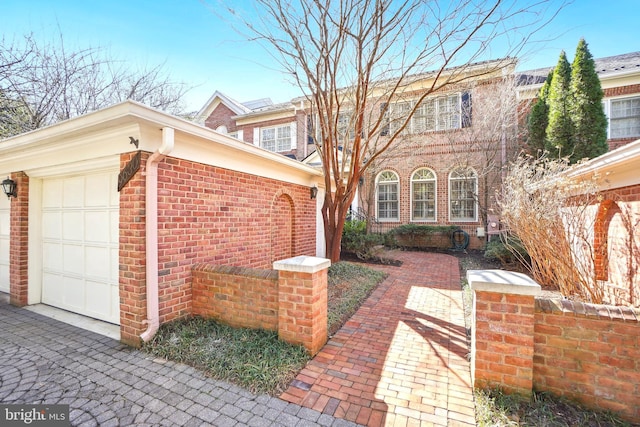 9630 Beman Woods Way, Potomac, MD 20854 - view of front of house with brick siding and a garage