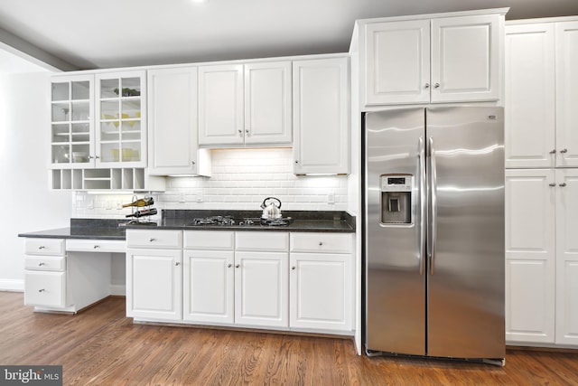 9630 Beman Woods Way, Potomac, MD 20854 - kitchen with stainless steel fridge, gas cooktop, white cabinetry, tasteful backsplash, and glass insert cabinets