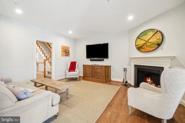 9630 Beman Woods Way, Potomac, MD 20854 - living area featuring stairs, wood finished floors, recessed lighting, a fireplace with flush hearth, and baseboards