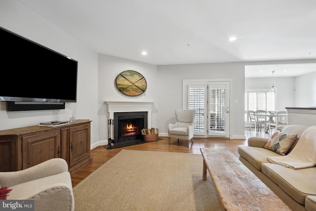 9630 Beman Woods Way, Potomac, MD 20854 - living area featuring a fireplace with flush hearth, recessed lighting, baseboards, and wood finished floors