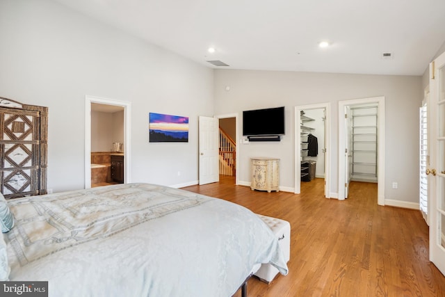 9630 Beman Woods Way, Potomac, MD 20854 - bedroom featuring wood finished floors, baseboards, a spacious closet, high vaulted ceiling, and recessed lighting