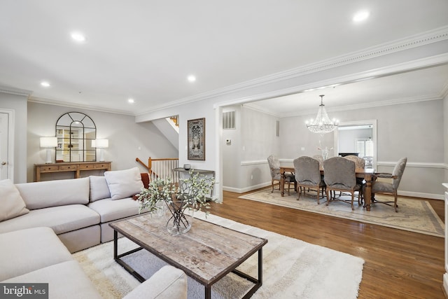 9630 Beman Woods Way, Potomac, MD 20854 - living area featuring wood finished floors, recessed lighting, baseboards, ornamental molding, and a chandelier
