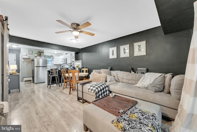 35 La Cascata, Clementon, NJ 08021 - living room featuring a ceiling fan and light wood-style flooring