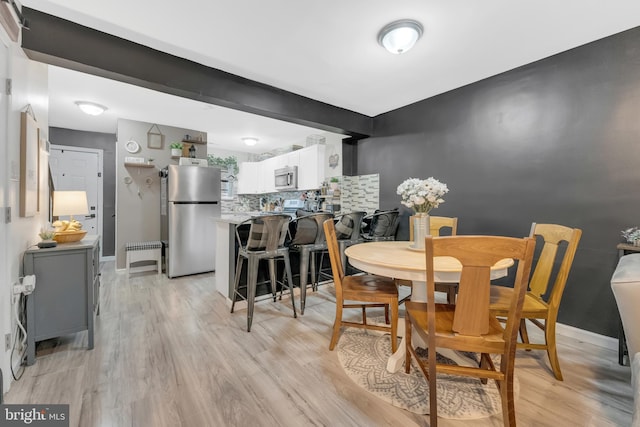 35 La Cascata, Clementon, NJ 08021 - dining area featuring light wood-style floors and baseboards