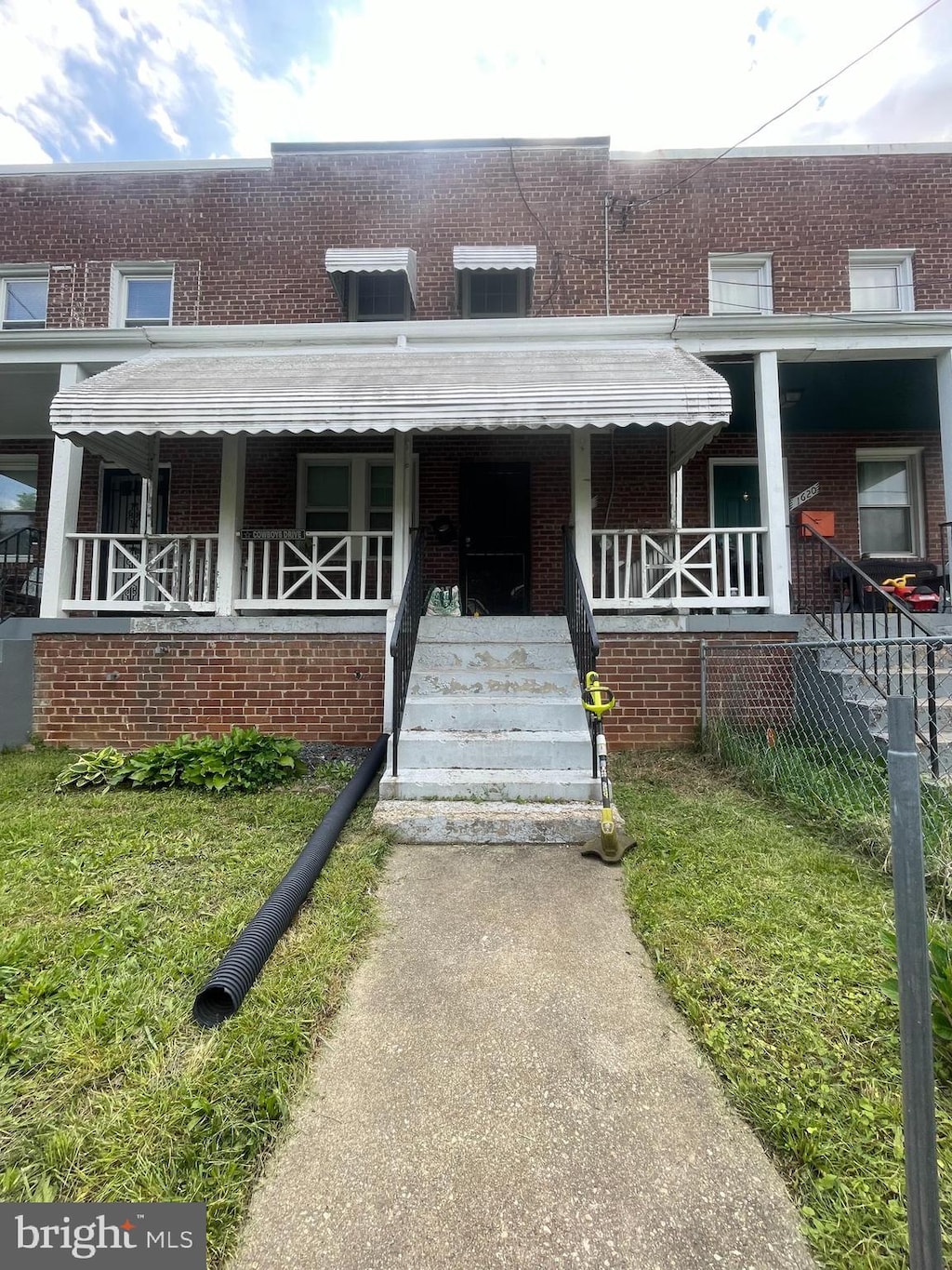 1618 Fort Dupont St SE, Washington, DC 20020 - view of property with brick siding and covered porch